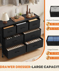 No-Fuss Seven Drawer Fabric Dresser With Bonus Storage Bins For Bedroom Organization And Durable Wooden Top That Handles Heavy Daily Gear While Dropping Clean Style In Tight Quarters displaying clothing in neatly organized drawers.