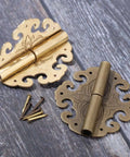 Two Piece Brass Flower Cloud Hinge Set For Jewelry Boxes And Furniture Decor with screws, 60x55mm, shown on wood surface