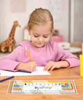 Child writing on a desk with a Clear Self Adhesive Desk Name Tag Pockets 40 Pack 14.5 By 4.3 Inch Thick Reusable Plastic Nameplate Sleeve
