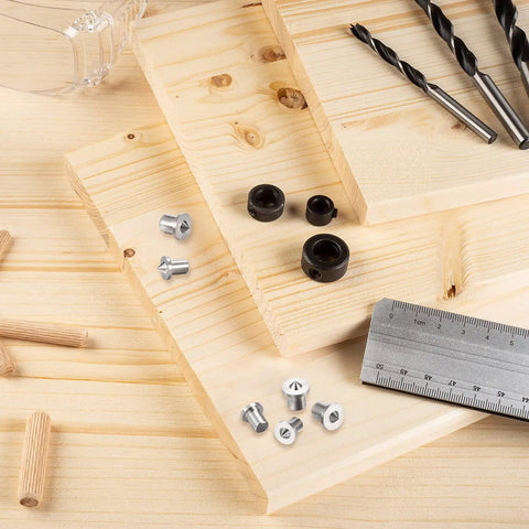 Pro Grade Dowel And Tenon Center Pins Set Features Twenty Four Pieces Across Six Exact Sizes on wooden boards with tools.