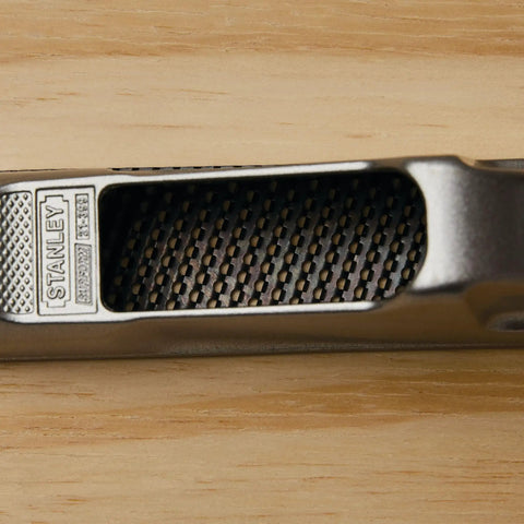 Close-up of 6 Inch Surform Pocket Plane handy for one handed use with quick blade tension on wooden surface