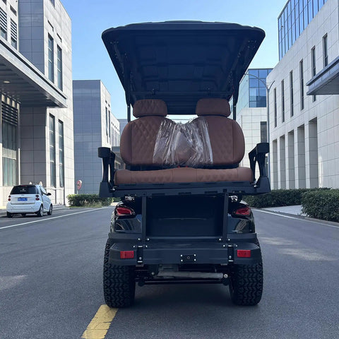 Hella Comfy 6 Seater Electric Golf Cart With Roof LED Light Bar showing plush diamond stitched seats from rear view on street.