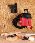 Tiny But Mighty One Gallon Wet Dry Vacuum with Fold Down Handle Mounted on Wall in Garage