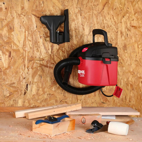 Tiny But Mighty One Gallon Wet Dry Vacuum with Fold Down Handle Mounted on Wall in Garage
