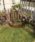 Garden Edging Kit With Rustic Picket Panels For Flower Beds And Landscape Borders Charred Wood Construction For Moisture And Rot Resistance 5.9 Inch High By 47 Inch Long 1 Pack installed in garden with flowers