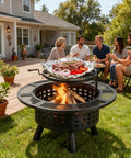 36 Inch Outdoor Fire Pit With Grill And Lid Wood Burning Fire Pit Table 3 In 1 Metal Fire Pit With Cooking Grate And Fire Poker For Bonfire Yard BBQ Jet Black in use, grilling food with people enjoying the backyard.