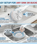 Straight Up Portable Mini Washing Machine With Ultrasonic Turbo Action And Grip Tight Suction Cups For No Sweat Laundry Care In College Dorms Or Camper Vans USB Powered, shown being attached to a sink.