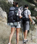 Hikers on trail with backpacks carrying an Ultra Lightweight 2 Person Backpacking Tent With Aluminum Poles Waterproof Rainfly.