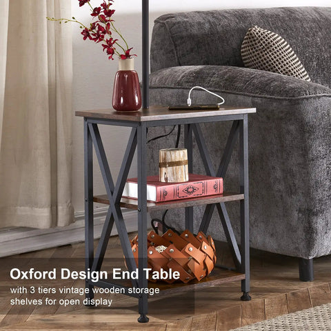 Oxford design end table in living room with three-tier wood storage, decorative items, and nearby sofa.