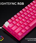 Compact Sixty Percent Wireless Gaming Keyboard Featuring Tactile Optical Switches And Sleek Magenta Build showcasing vibrant pink keys and customizable RGB lighting.