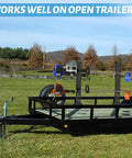 Beefy Sturdy Rustproof Trimmer Rack For Open Trailers Lockable Weed Eater Rack For Lawn Equipment Landscape Trucks With Heavy Duty Steel Construction And 2 Locks shown installed on a trailer in a field.