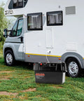 Hella Tough Group 24 27 Battery Box With Badass Double Strap Lockdown For 12V 24V Agm Lithium near RV on green grass.