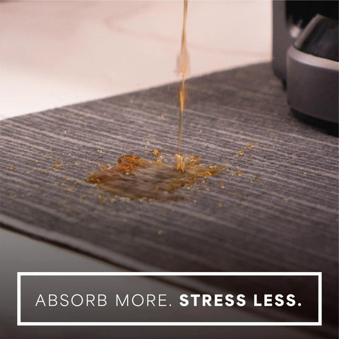Absorbent Coffee Mat For Countertops 12 By 18 Inch Spill Catcher Pad absorbs coffee spills near a coffee maker.