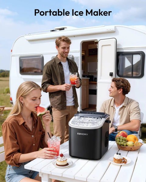 Amazon EUHOMY black countertop ice maker with handle, portable unit on an outdoor table beside a camper.