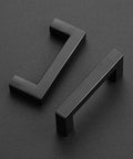 Two matte black square bar cabinet handles, 3 inch center to center drawer pulls, part of a 10 pack for kitchen cabinets.