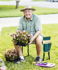 Man using the Garden Kneeler And Seat Foldable Bench with EVA Foam Pad, planting flowers in a garden, tool pouch attached.