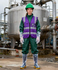 Top Shelf Welding Goggles 4 Pack With Splash Resistant Lens And Impact Rated Frame worn by a worker at an industrial site.