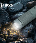 Go-To Telescopic Camping Lights With Storage Bag, 10500mAh Rechargeable Outdoor Lantern For Camping, Hiking, And Emergencies, Waterproof LED Work Light With Magnetic Base, Portable Gray Design For Any Weather, shown lit on wet stones with IPX5 waterproof indicator.