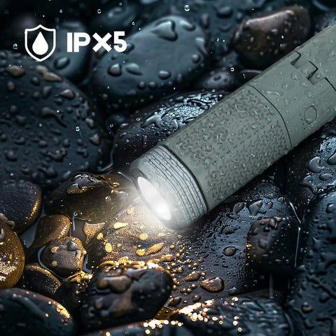 Go-To Telescopic Camping Lights With Storage Bag, 10500mAh Rechargeable Outdoor Lantern For Camping, Hiking, And Emergencies, Waterproof LED Work Light With Magnetic Base, Portable Gray Design For Any Weather, shown lit on wet stones with IPX5 waterproof indicator.