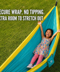 Child enjoying Ultra Lightweight Camping Hammock With 500 Lb Capacity And Tree Straps for outdoor adventures