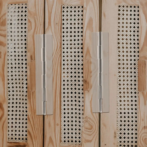 Self Adhesive Inset Cabinet Hinge Set for Tiny DIY Projects on wooden cabinet with foldable clear plastic design.