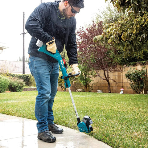 Man using 18V Cordless String Trimmer With 180 Degree Rotating Head Converts To Edger, Telescoping Shaft Extends from 48.25 to 56.5 inches