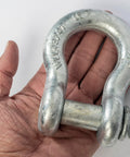Hand holding Four Pack Galvanized Bow Shackles Three Quarter Inch D Ring Shackle With Seven Eighths Inch Screw Pin Heavy Duty