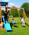 Children playing on Backyard Cedar Outdoor Swing Playset With Two Belt Swings, Fort With Sloped Roof, Sandbox, Ladder, 6 Foot Slide