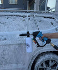 5000 PSI Beast Power Pressure Washer Gun With Swivel and Foam Cannon cleaning a car, showcasing heavy-duty application.