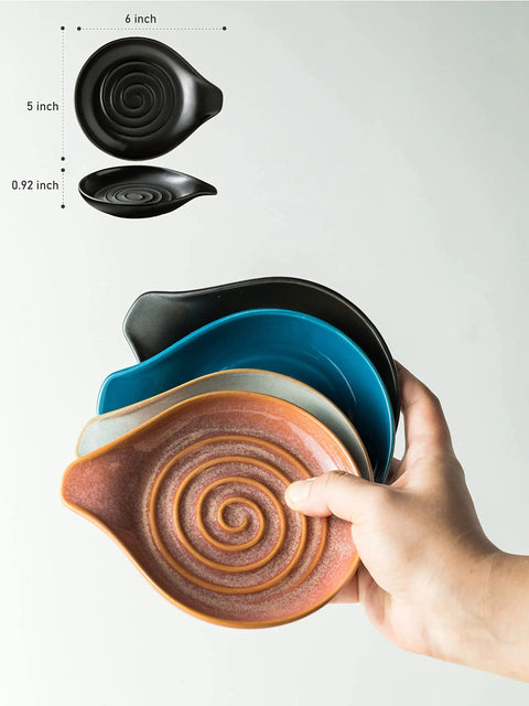 Hand holding a collection of colorful ceramic trays, showcasing Porcelain Spoon Rest And Drip Tray For Multiple Utensils On The Stovetop Huge Capacity Go To Utensil Holder For Spoons Ladles Tongs And Spatulas Black Farmhouse Kitchen Decor.
