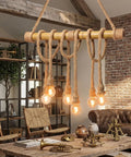 Chandelier made from heavy duty natural hemp rope with exposed bulbs in a rustic setting