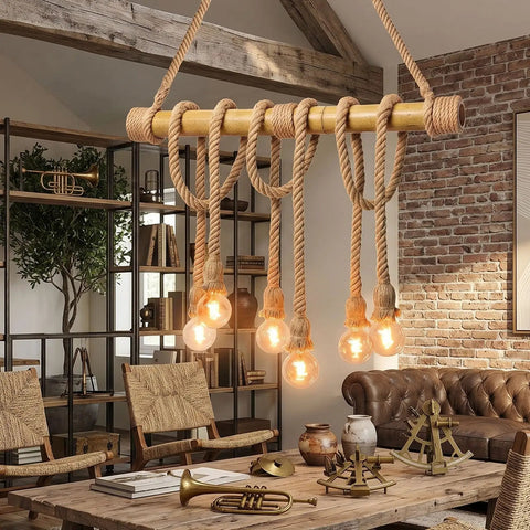 Chandelier made from heavy duty natural hemp rope with exposed bulbs in a rustic setting