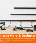 Built Like A Tank 16 Outlet Surge Protector Power Strip With 6 Foot Extension Cord mounted on wall powering tools in workspace.