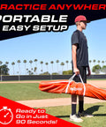 Person holding a carry bag of 7 Ft X 7 Ft Baseball And Softball Practice Net With Bow Frame Carry Bag And Strike Zone Backyard Hitting Pitching Fielding Training For All Skill Levels Easy Setup In 90 Seconds on baseball field