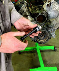 Mechanic using Long Reach Harmonic Balancer And Pulley Installer Kit with Extra Long Forcing Fasteners on engine