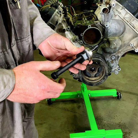 Mechanic using Long Reach Harmonic Balancer And Pulley Installer Kit with Extra Long Forcing Fasteners on engine