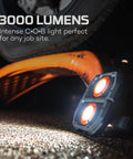 Omni 3K Rechargeable Work Light With 3000 Lumens illuminating undercarriage, portable and rugged for job site use.
