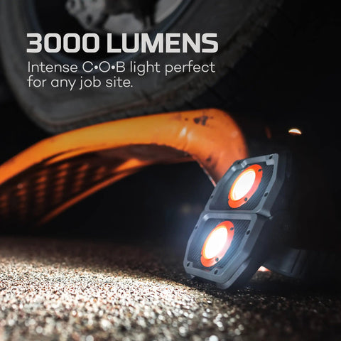 Omni 3K Rechargeable Work Light With 3000 Lumens illuminating undercarriage, portable and rugged for job site use.