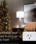 Smart Plug Indoor Bluetooth And Wi Fi Outlet Socket Works With Alexa And Google Assistant Plug shown near decorated Christmas tree.