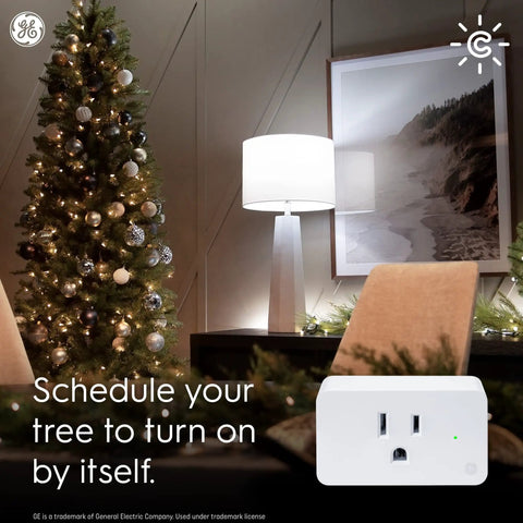 Smart Plug Indoor Bluetooth And Wi Fi Outlet Socket Works With Alexa And Google Assistant Plug shown near decorated Christmas tree.
