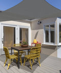 Triangle Sun Shade Sail 16 Foot By 16 Foot By 22.64 Foot UV Block Canopy in graphite over patio with outdoor furniture