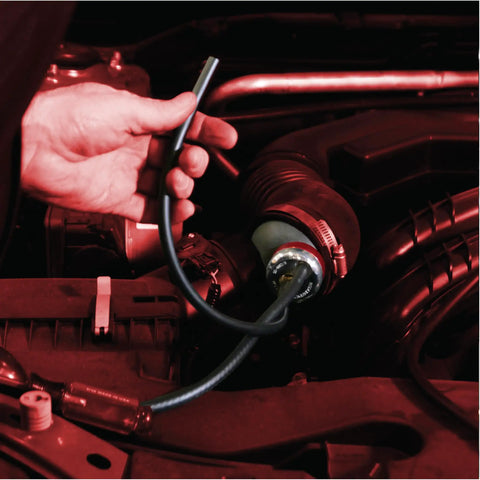 Mechanic using EVAP Bundle Smoke Machine Adapter Kit For Visible Vapor And Low Pressure Diagnostics on car engine