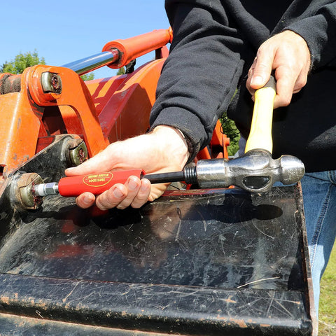 Grease Buster by LockNLube, red-handle tool used to flush old grease from fittings on orange equipment.