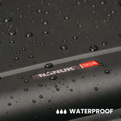 Freakishly Durable IP67 Waterproof Hard Shell Case Built For Tough Travel Days with water droplets on matte black finish.