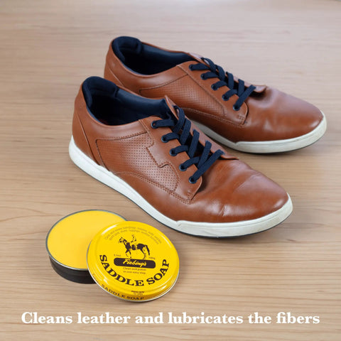 Yellow Saddle Soap Leather Cleaner And Conditioner All In One For Boots Kicks Bags Saddles And More next to brown sneakers