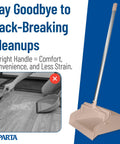 Commercial Upright Dustpan With 30 Inch Aluminum Handle Serrated Broom Comb Edge And Locking Yoke Standing Floor Sweeper Tan on a wooden floor.