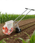 Manual Hand Push Garden Seeder With Stainless Steel Duckbill, Clear Seed Box, Roller Wheel in cornfield for easy sowing