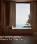 Bathroom with large window and ocean view, featuring Honesty Collection Wall Mount Bath Spout Non Diverter Polished Chrome.