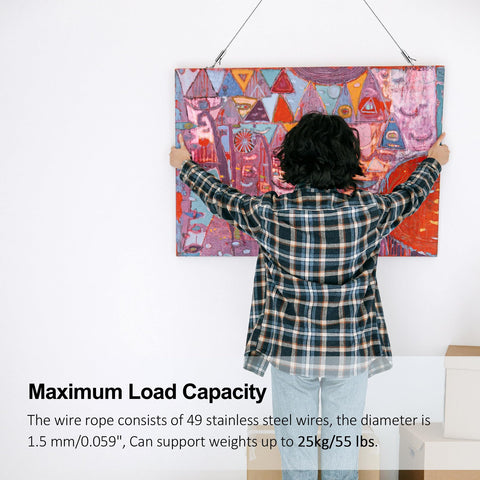 Person hanging art with Stainless Steel Picture Hanging Wire Kit, 25Kg Load, 2 Pack, Adjustable 2M Wire Rope With D Ring