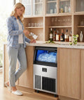 Woman using Beast High Capacity Commercial Ice Maker For Home Bar And Cafe 200 Lbs Per Day With 55 Lb Storage Stainless Steel